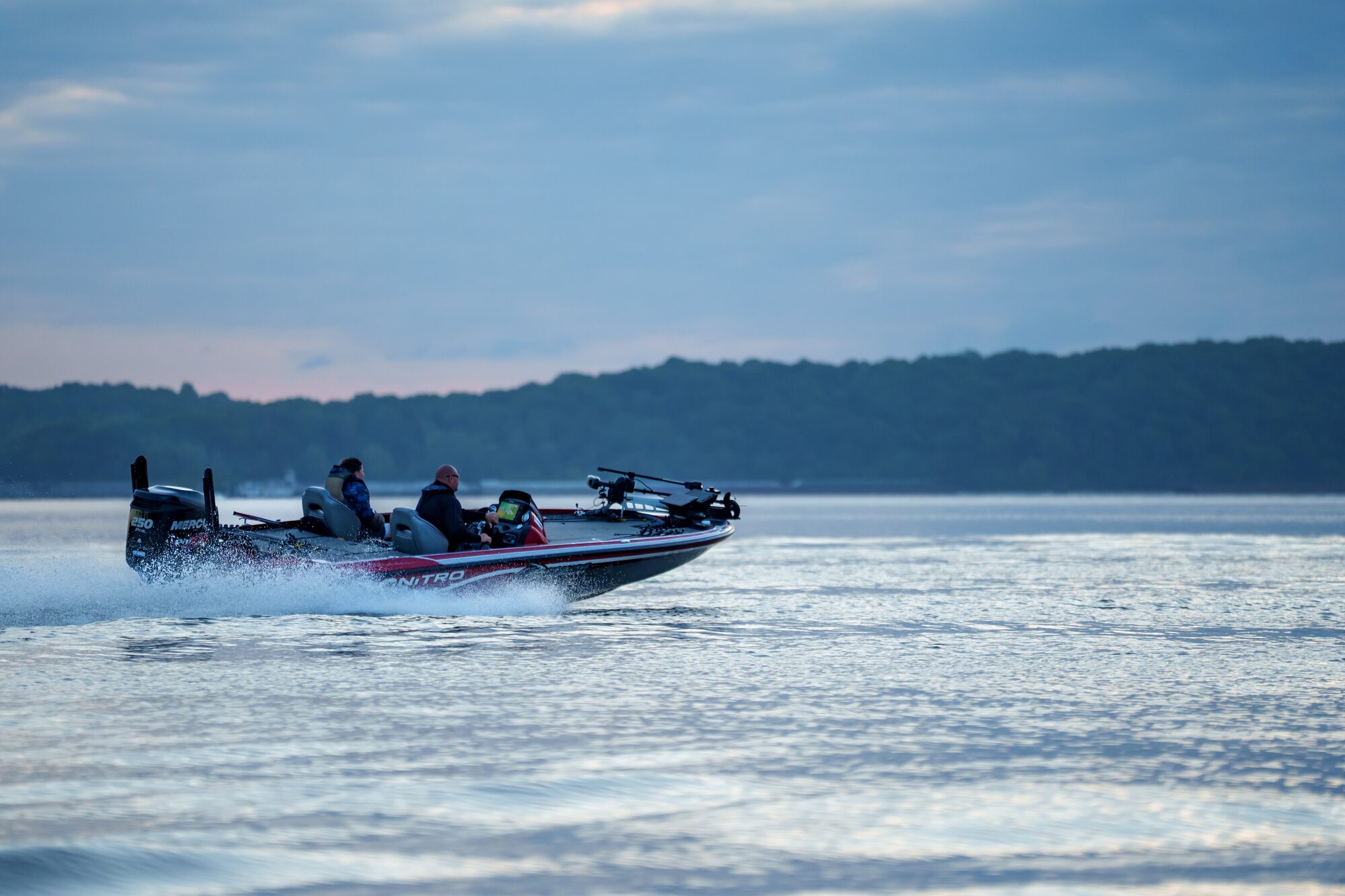 Bass boat running across the lake