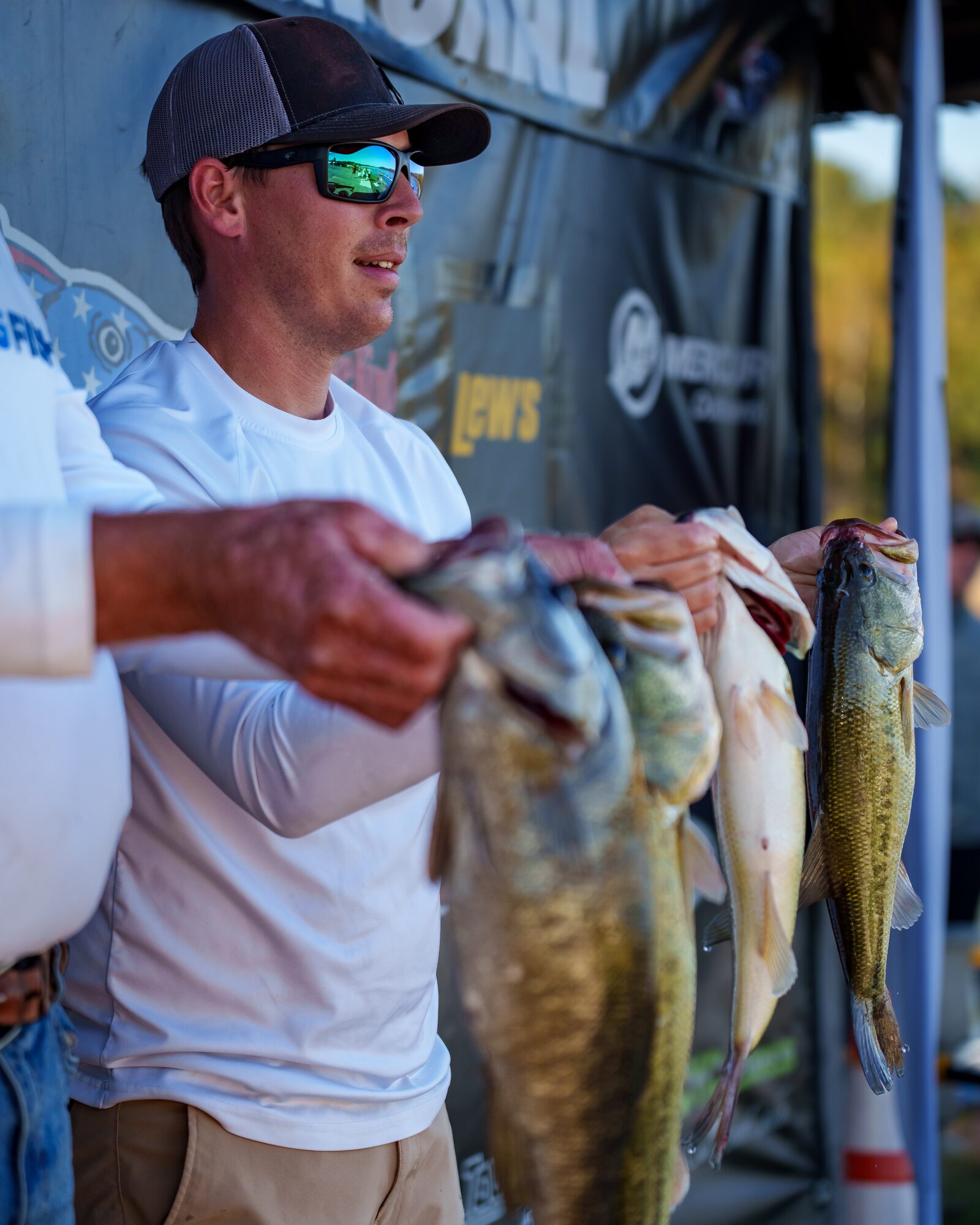 Angler presenting bass during USA BASSIN weigh-in