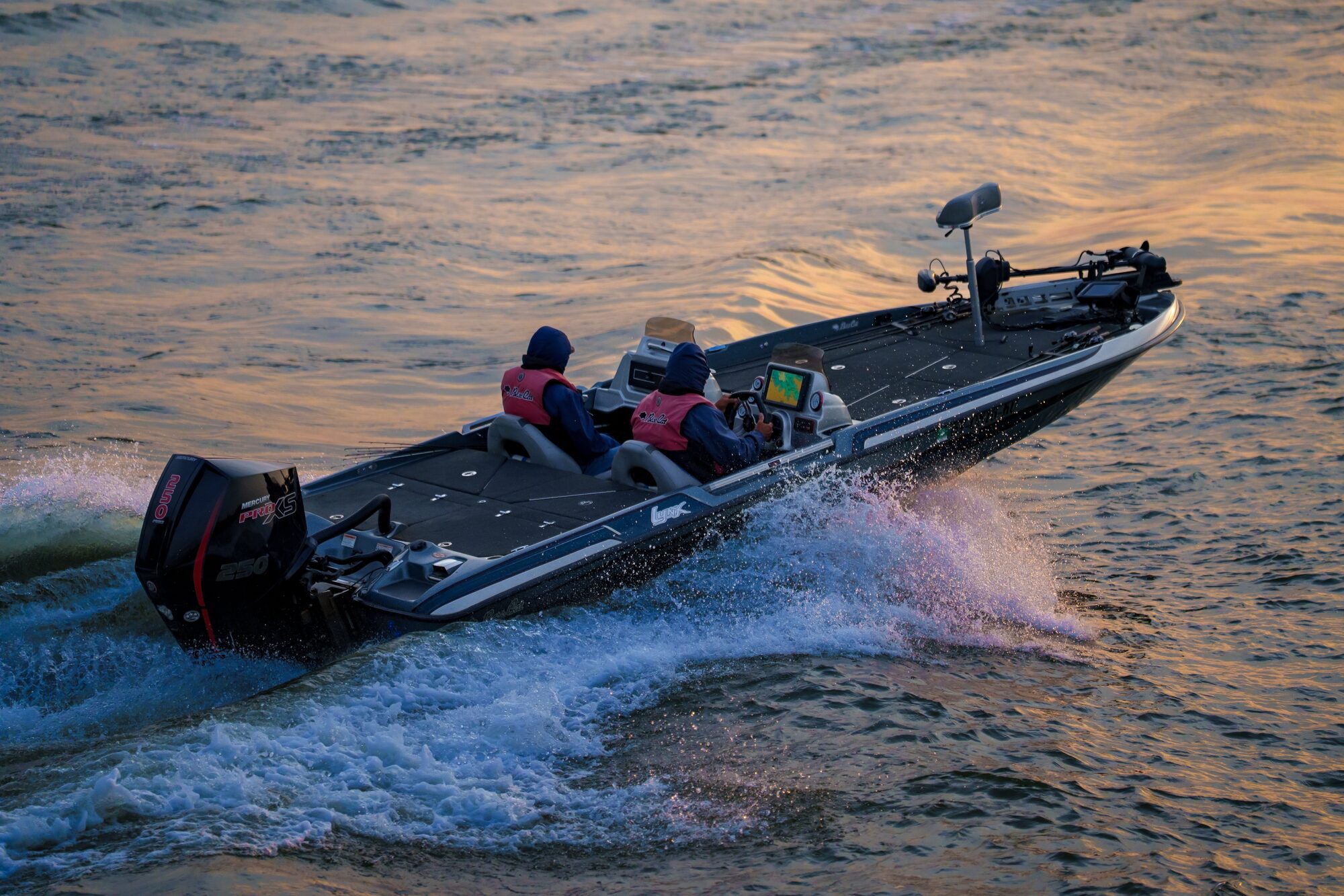 USA BASSIN boat running across the water at sunrise